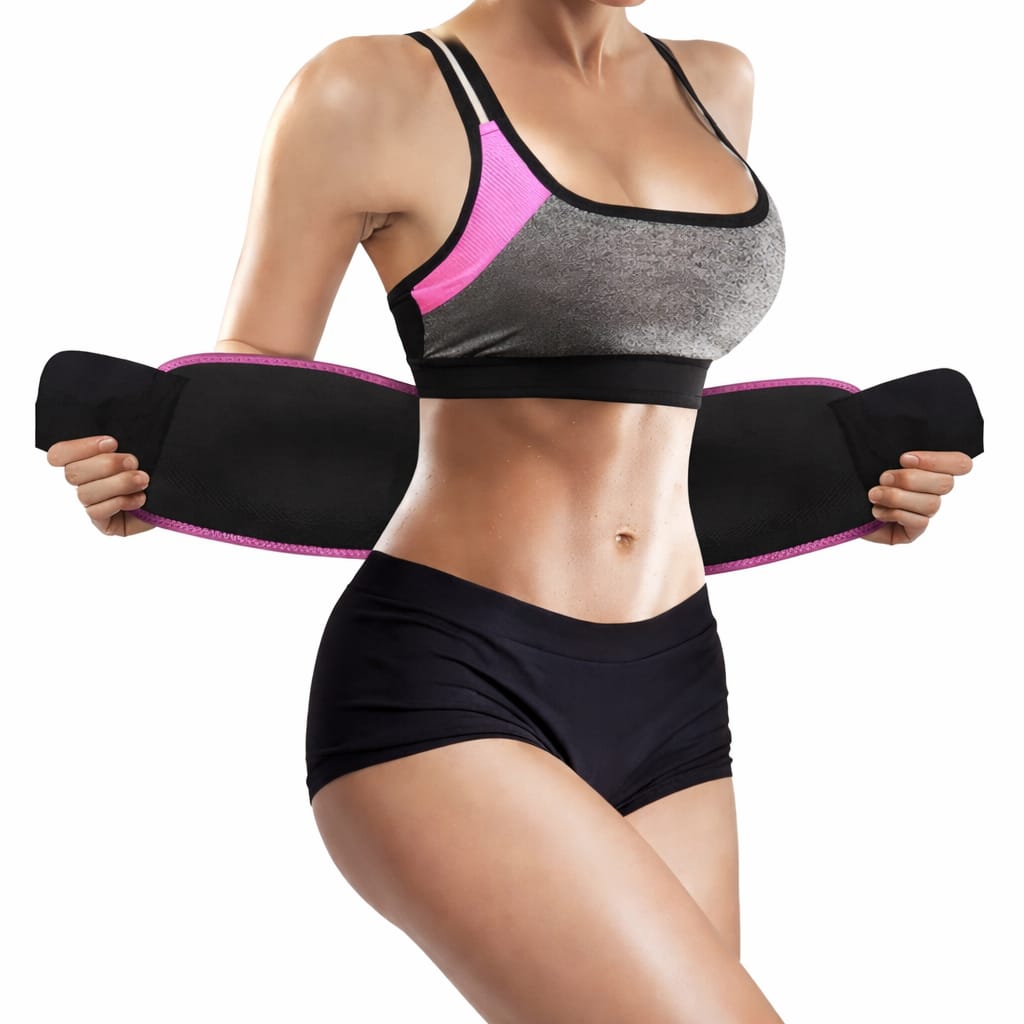 Person wearing a black and gray sports bra with pink accents and black shorts, holding a black waist trainer.